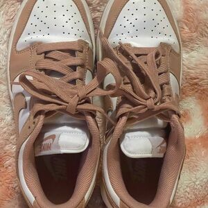 Nike Tan and White Sneakers with Perforated Upper and Low-Top Design